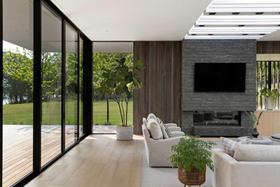 A living room with a Marvin Signature Modern Multi Slide door and Direct Glaze Window