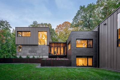 A modern home featuring Marvin Ultimate Direct Glaze Narrow Frame and Ultimate Casement Narrow Frame windows and a Marvin Ultimate Bi-Fold door.