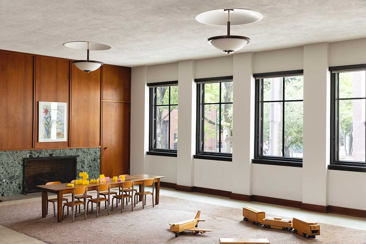 A community space inside Christ Episcopal Church in Reading, PA, featuring Marvin Ultimate windows with wooden toys on the floor and a child size table on one side.