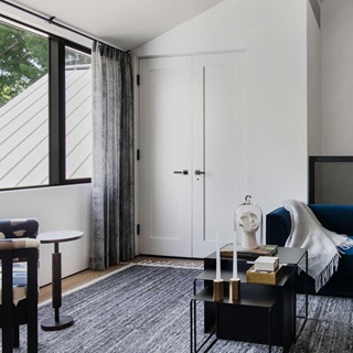 A sitting room in Stay Bungalow in Austin, Texas, featuring Marvin Modern Direct Glaze and Marvin Modern Casement windows.