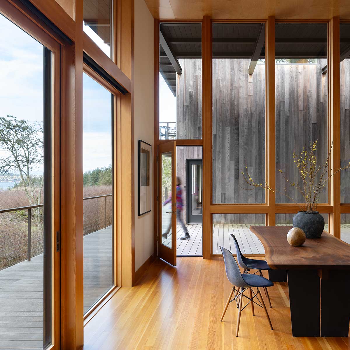 Living room with Marvin Signature Ultimate Direct Glaze windows and Multi-Slide Door