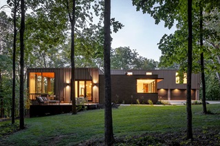 Exterior of home with Marvin Signature Modern Awning, Direct Glaze, Ultimate Direct Glaze, and Narrow Frame windows