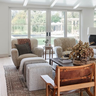 A seating area in Amber Lewis’s Calabasas, California home, featuring a Marvin Signature Ultimate Multi-Slide Door.