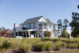 Exterior of home with Marvin Elevate Casement and Awning Windows and Signature Ultimate Inswing French Door